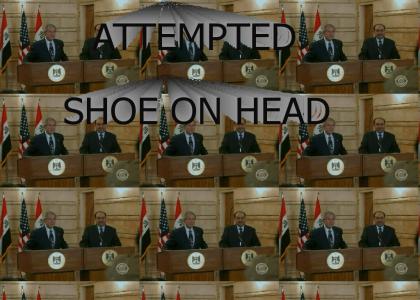 Iraqi attempts to put shoe on head (PLZ DOWNVOAT)