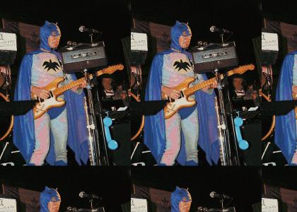 Batman plays guitar