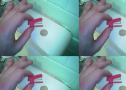 Tiny red stapler