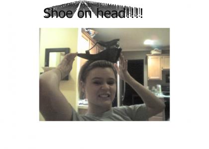 Grace puts shoe on head