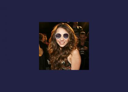 Miley wears her sunglasses at night