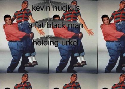 kevin hucik is a fat black man holding urkel