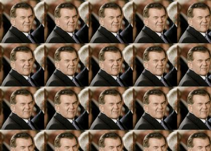 Tom Ridge winks at you.