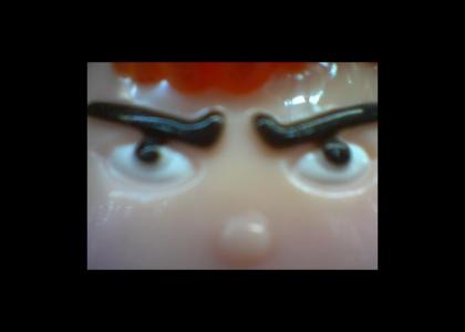 Plastic man stares into your soul...