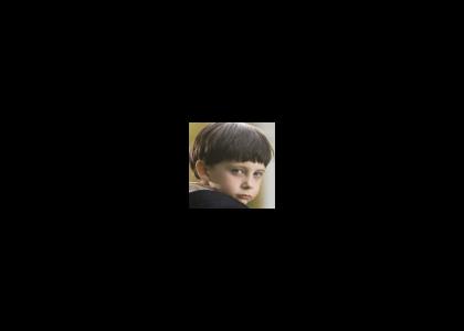 The boy from The Omen stares into your soul