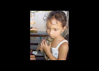 Little Girl holds Dead Kitten