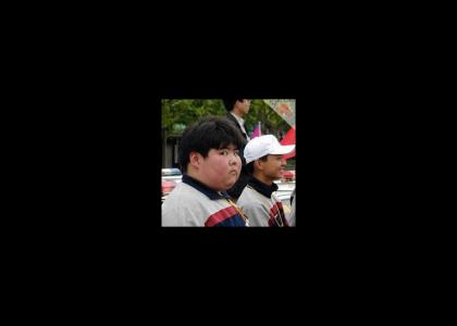 Fat Asian Kid doesn't change facial expressions