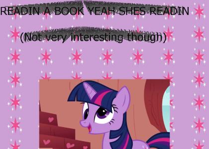 Twilight Sparkle is reading a book.