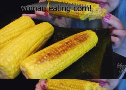 woman eats corn